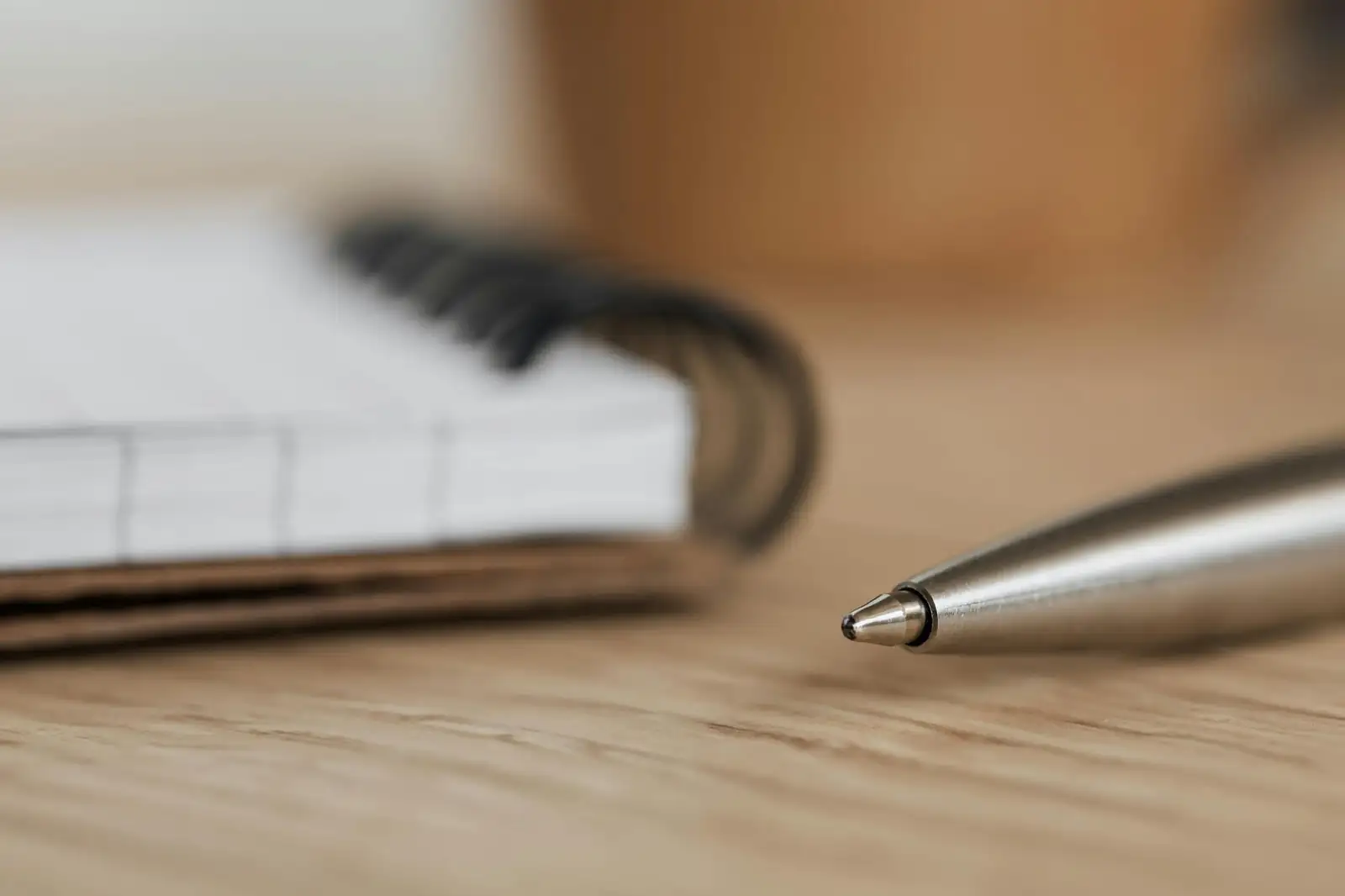 A notebook and pen on a desk