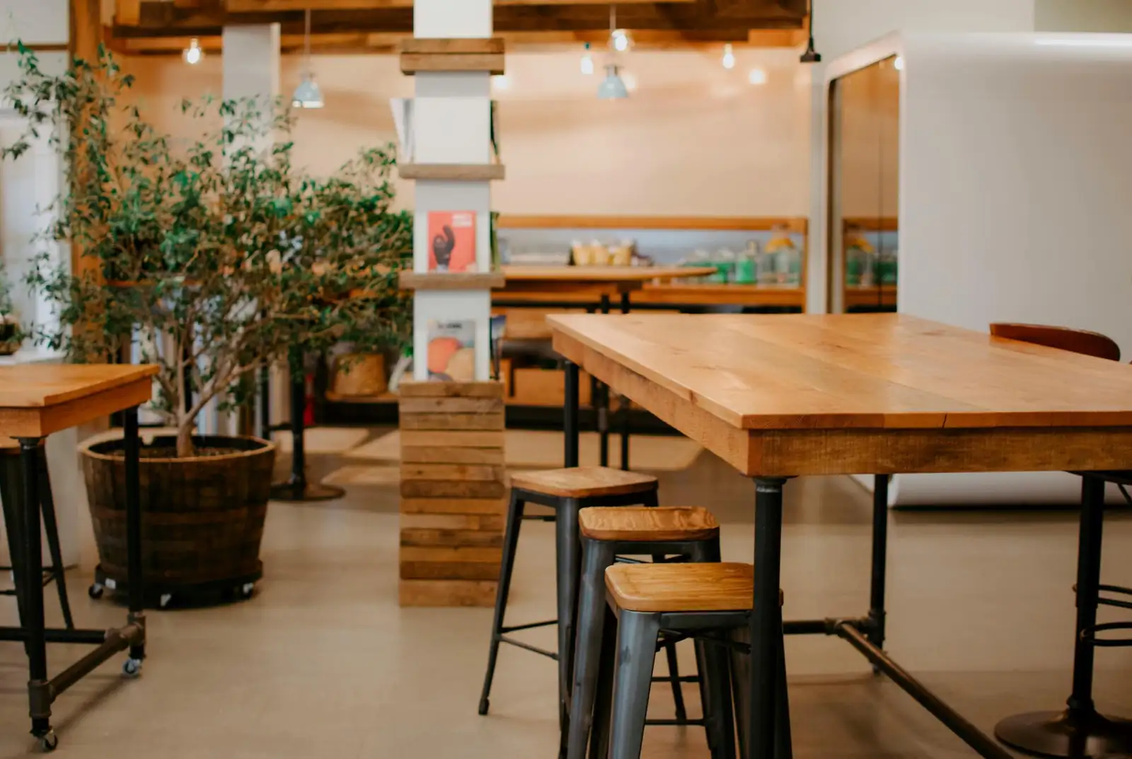 Tables and stools in a bright cafe