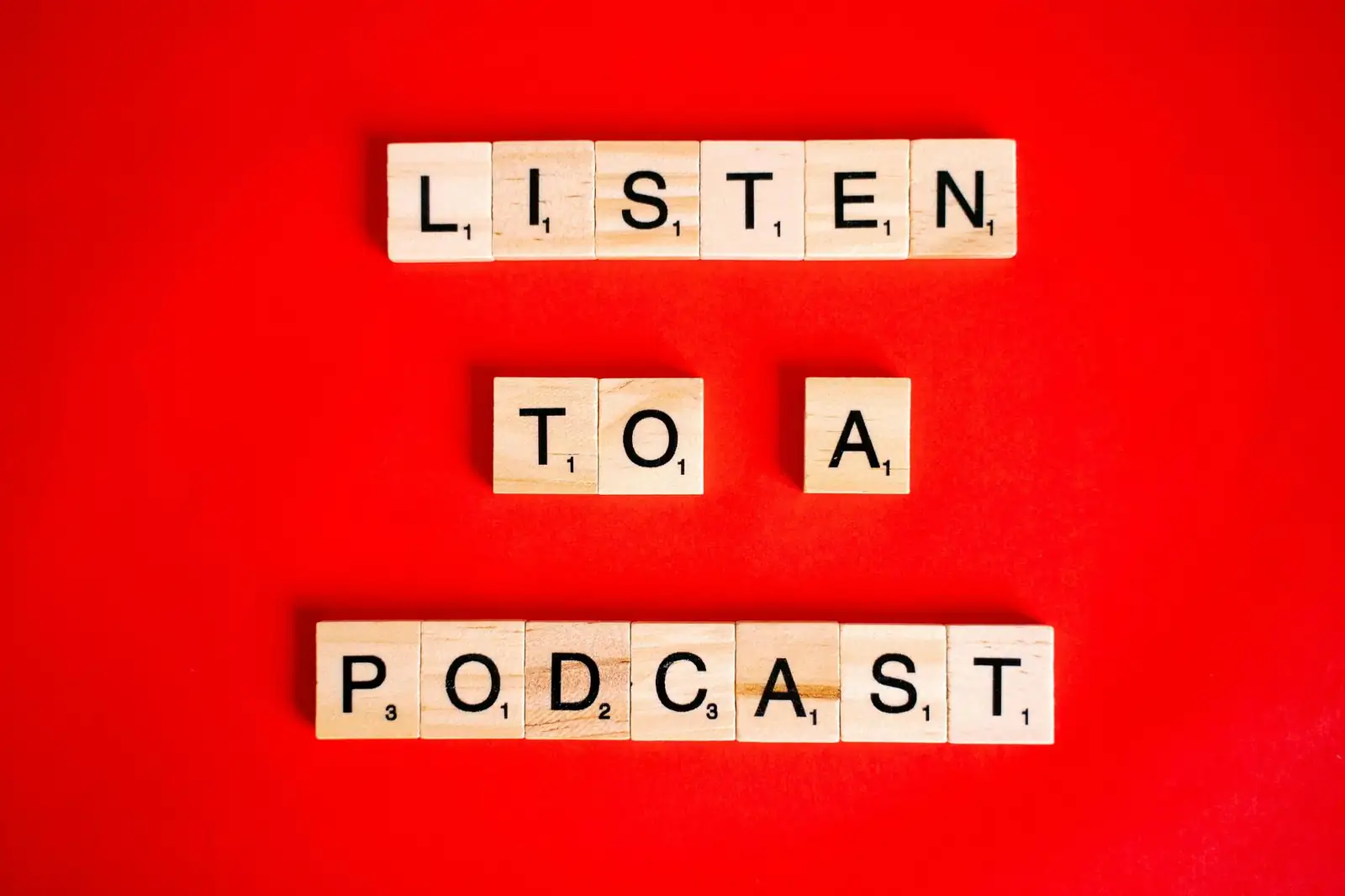Letter tiles spelling Listen to a podcast